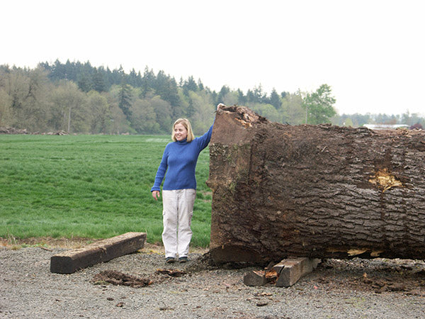 Sara Judy next to a fallen tree